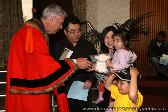 Kids love the lambs and caps, just part of the family affair at a Citizenship Ceremony at Hastings District Council this week. photograph